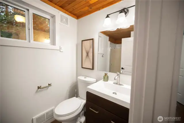 Bathroom with shower just off of the main level primary bedroom.