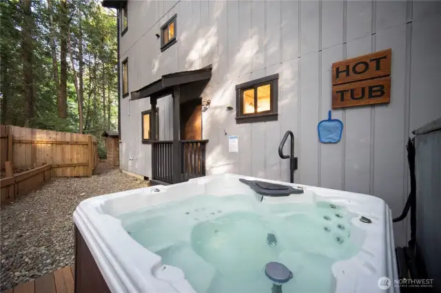 This hot tub completes the perfect blend of indoor-outdoor living for a relaxing evening. Listen to the sounds of the wind in the trees and the birds chirping.