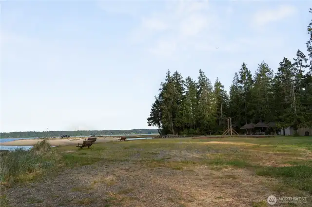 One view of some of the private beaches. Picnic shelters are in the far corner to the right, along with swings. More beaches behind with views of the Olypic Mountains. You can see Mt Rainier off in the distance of this photo. What could speak more of the Pacific Northwest than trails through the evergreens, tranquil beaches along the sound, and views of snow covered mountain ranges.