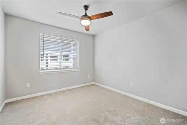 Upstairs bedroom facing side of home