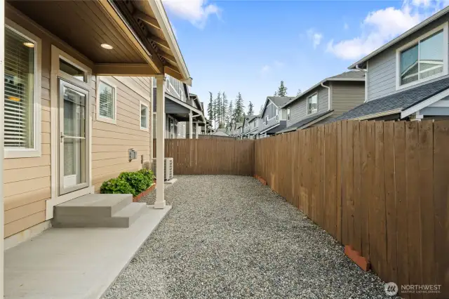 Low maintenance backyard with covered patio