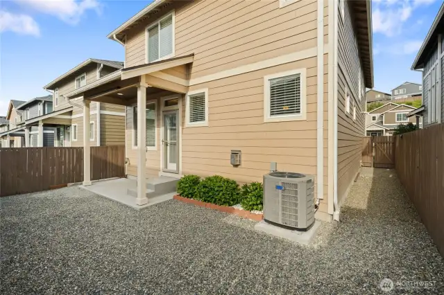 Low maintenance backyard with covered patio