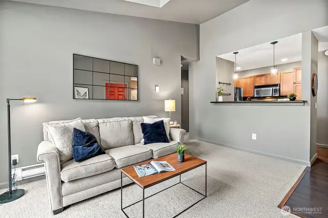 Inviting living space with vaulted ceilings feels both stylish and spacious
