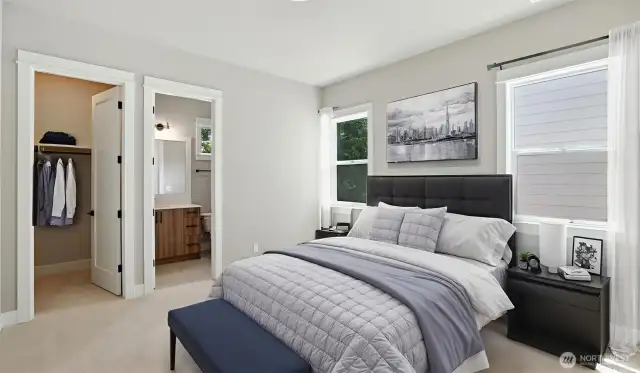Main Level Guest Bedroom Suite, complete with a 3/4 Bath, is ideal for multi-generational living arrangement, or extended-stay guests. Virtually staged.