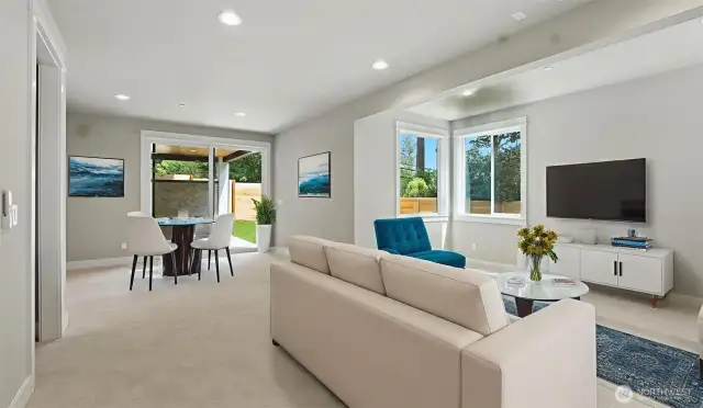 Lower Level Rec Room is pre-wired with 7.1 Surround Sound and for a projector. You're ready for game day or movie night with this Rec Room! Virtually staged.