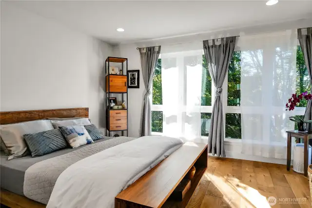 Primary Bedroom on the 4th floor - one floor up from entry level. Gorgeous diffuse light through the trees.