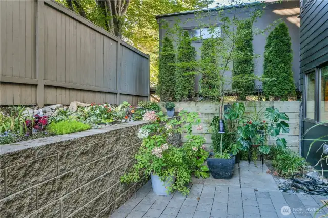 Private garden patio space. Covered parking spot located behind this photo several steps away.
