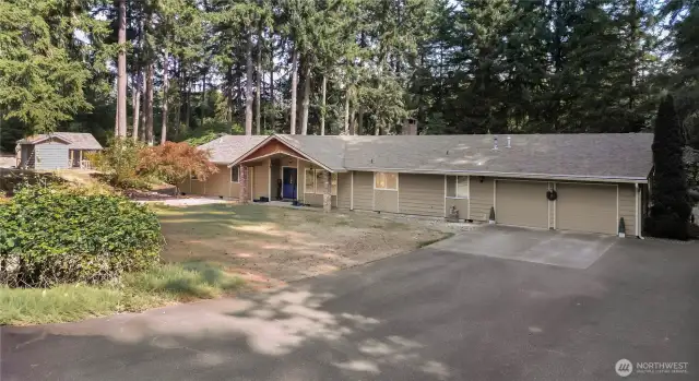 nestled amidst the enchanting beauty of old-growth firs on a sprawling 4.2-acre lot.