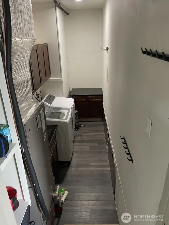 separated washing room with lots of storage space