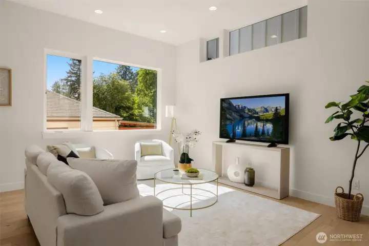 Elegant living room framed by expansive windows.