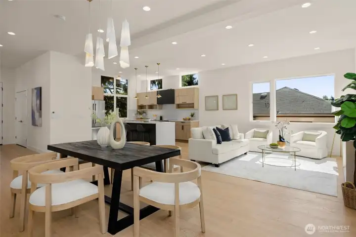 Chic dining under a statement chandelier.