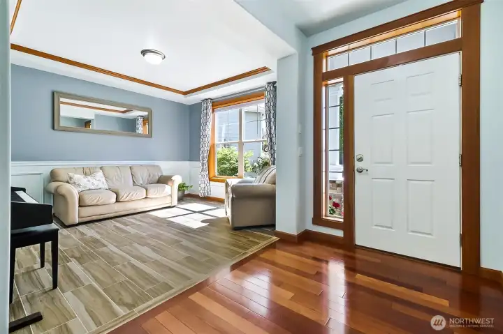 This view of the Living Room shows off the beautiful trim & moldings found throughout the Home.