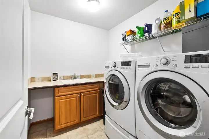 The Laundry Room is conveniently located upstairs & features a utility sink & folding space.