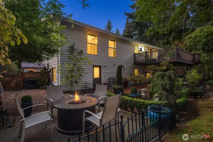 Enjoy the peaceful garden ambiance. The multi-level design offers both lounging and dining areas—perfect for entertaining or unwinding under the trees.