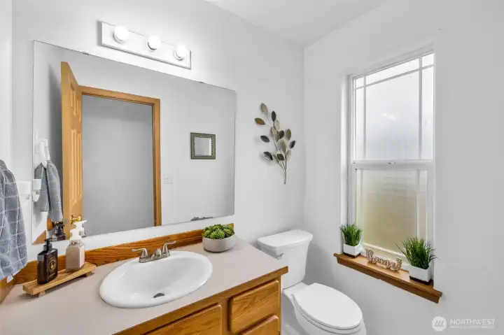 Powder room right off of the entrance.