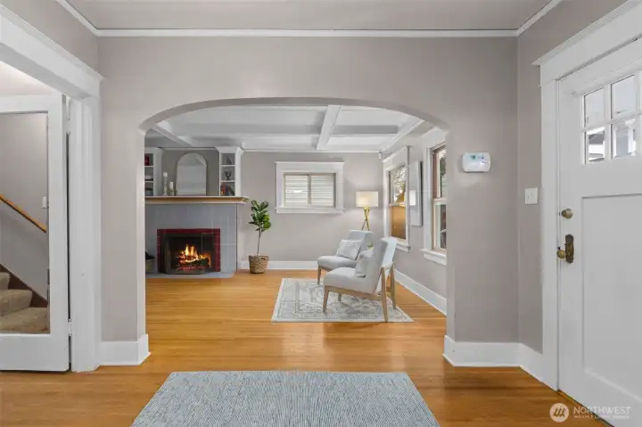 Classic arched doorway leading into the living room.