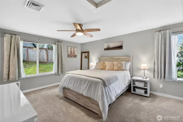 Primary bedroom with walk-in closet and full bath
