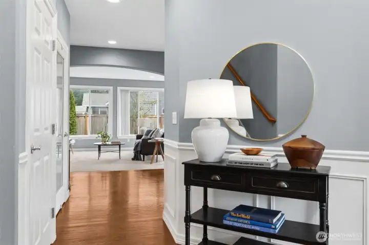 Soaring Ceilings over gleaming hardwoods greet you