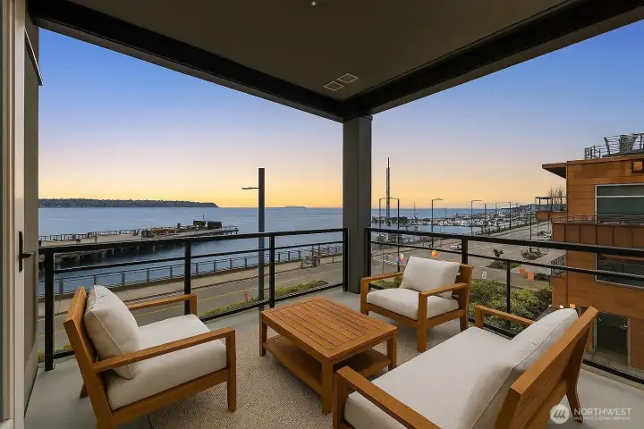 Private covered balcony with Sound, Mountain views and incredible sunsets (virtually staged)