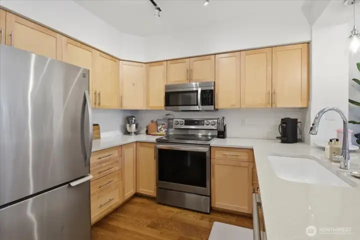 Beautiful wood cabinetry provides plenty of storage space.