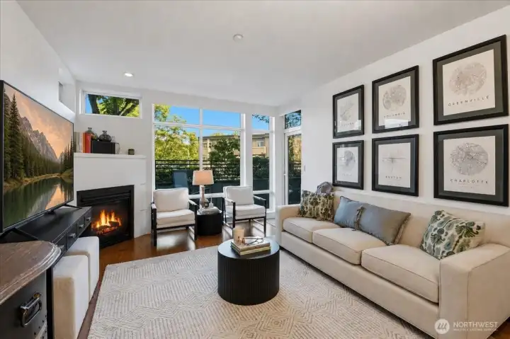 An inviting gas fireplace, with decorative mantle space.
