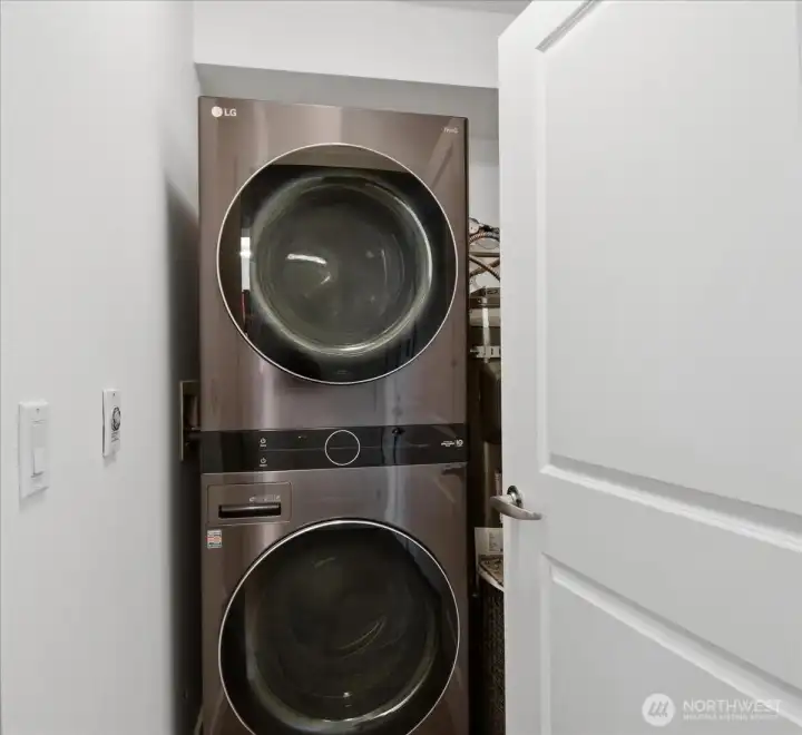 Full sized washer and dryer, plus shelving.