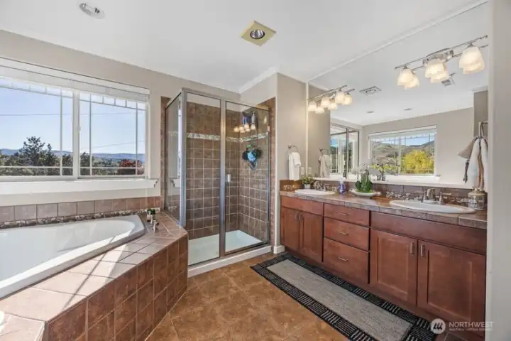 Large Primay full bathroom with shower and soaking tub, double vanities