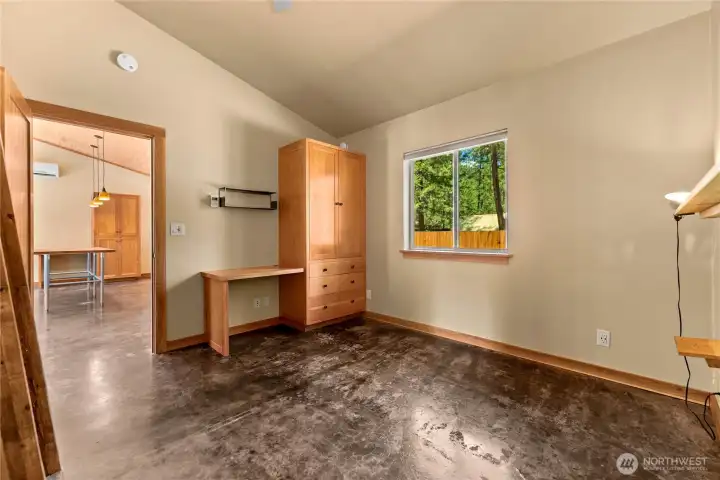Bedroom in main house with heated floor and custom built-ins