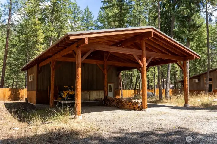 Huge, solid carport for your RV, trailer, and/or van with climbing gym workout room in the back