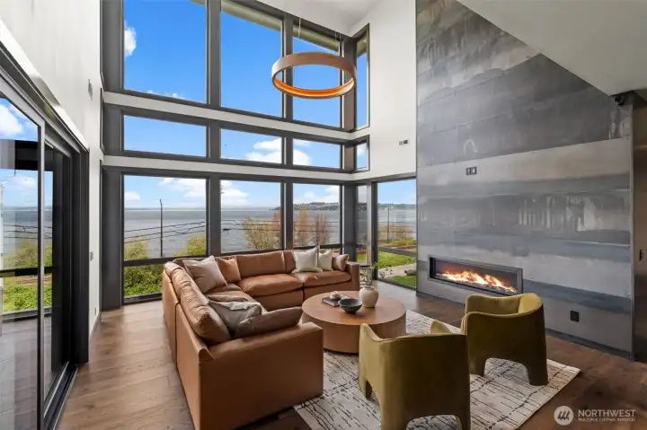Cozy fireplace and seamless access to outdoor spaces create a great setting.