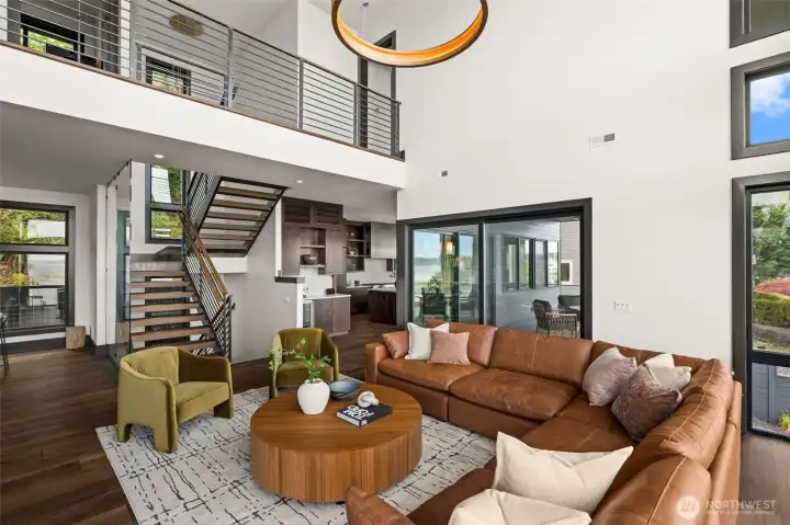 Bright living area with elevated ceilings.