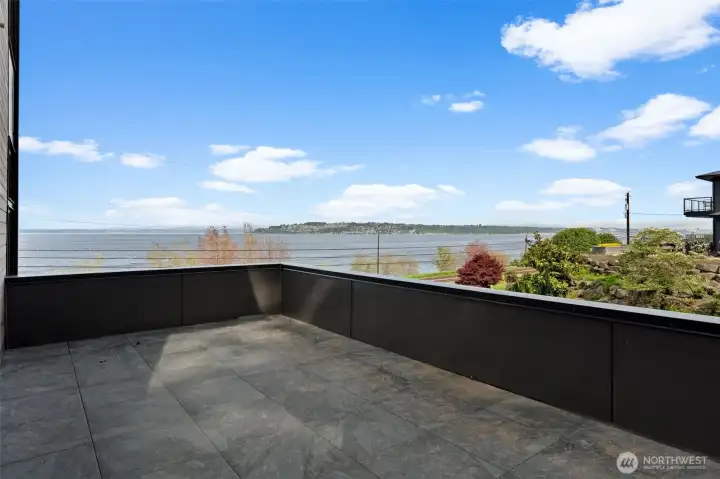 Outdoor area off the dining space, offering water views and a great setting for relaxing or dining outside.