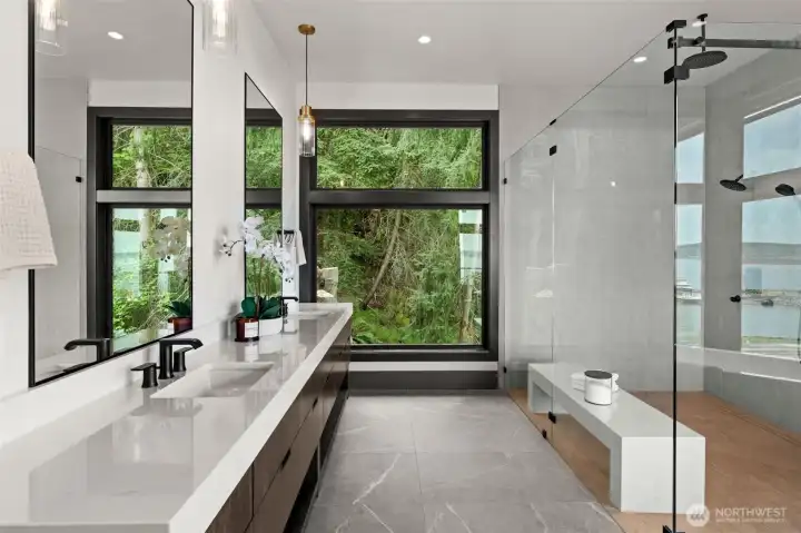 This elegant primary en suite creates a tranquil retreat.