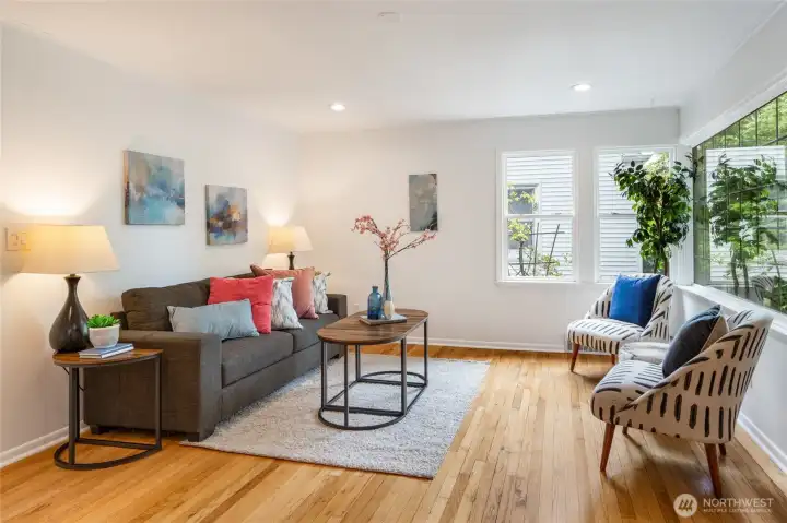 Hardwood floors sparkle in warm sunlight.