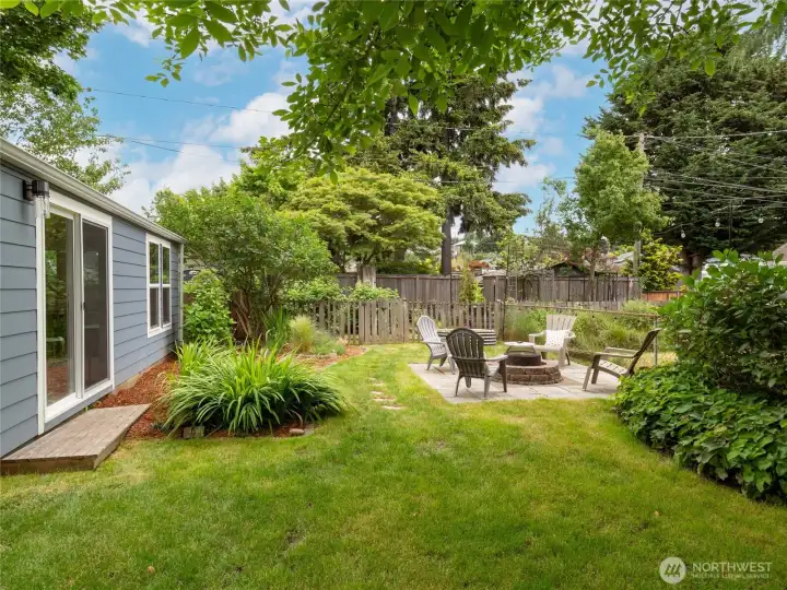 The sliding door from the studio opens to beautiful mature landscaping. Hydrangea, blueberries, and more await your green thumb.