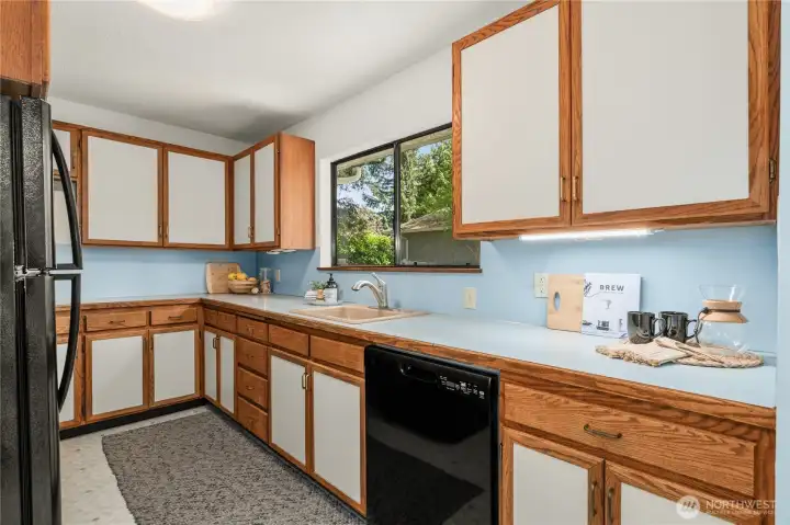Bright kitchen with a lovely view the backyard.