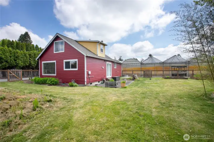 Farmhouse on 1.6+ acres on quiet road, with over 13,000 square feet in greenhouses, 10 minutes to Bellingham and 5 minutes to Ferndale.