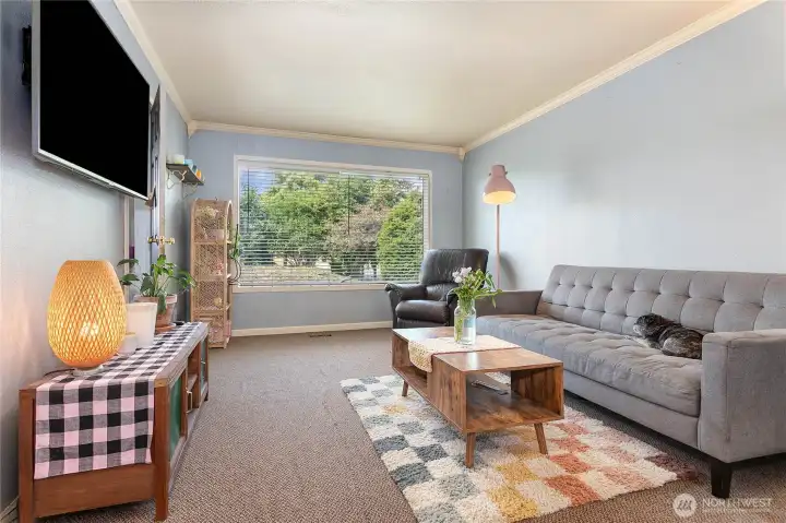 Living room with large windows and private views.