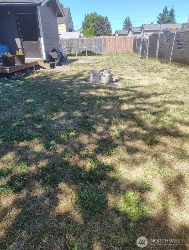 Back yard area with driveway off of the alley.  Room to park