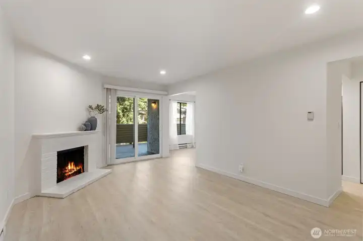 A functional living room filled with abundant natural light and a peaceful atmosphere.