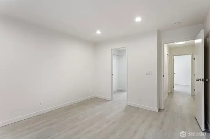 The primary bedroom is spacious enough to comfortably fit a king-size bed and more.