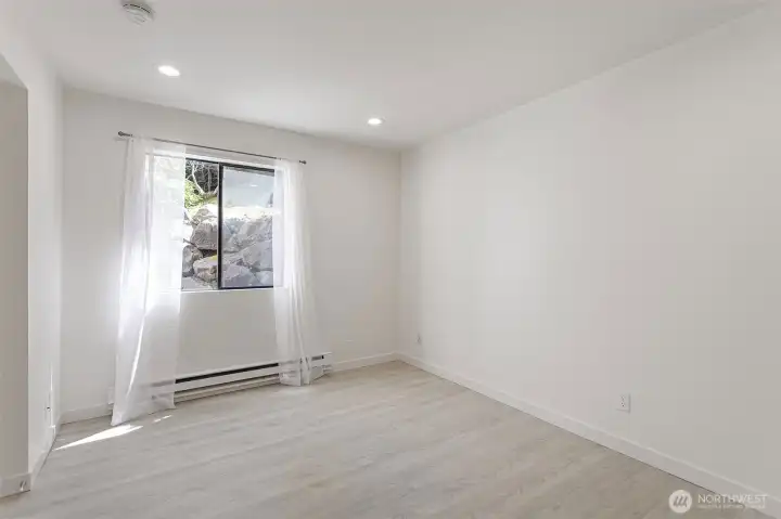 The second bedroom is cool and filled with natural light.