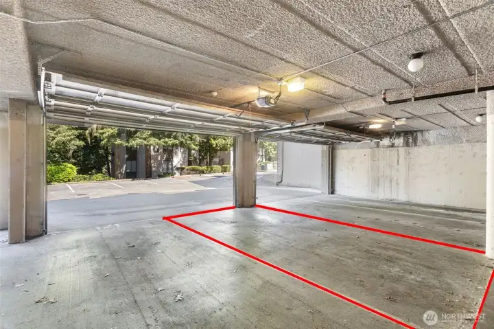 The unit includes two designated parking spaces: #170 in the garage and #192 located in front of the building.