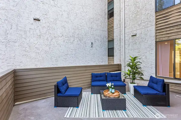 The expansive deck creates a true indoor-outdoor living experience, with a partially covered area providing extra comfort. It’s the perfect space to relax, gather with friends, exercise, or simply enjoy the natural surroundings and the sounds of birds.