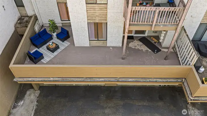 The expansive deck creates a true indoor-outdoor living experience, with a partially covered area providing extra comfort. It’s the perfect space to relax, gather with friends, exercise, or simply enjoy the natural surroundings and the sounds of birds.