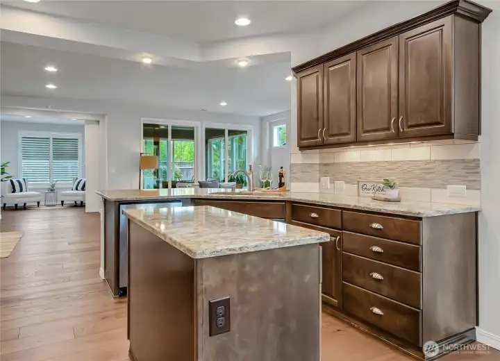 Granite counters, full-height backsplash, slow-close drawers and cabinets, under-cabinet lighting and many other upgraded features. New dishwasher and fridge plus washer and dryer, convey, too. Home fully loaded with appliances (covered by whole-house warranty, too).