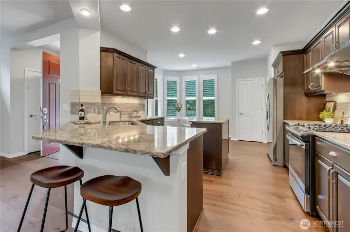 Cool kitchen with nice bar for serving friends and family.