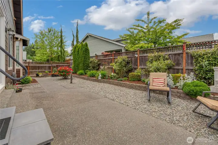 Much of the garden space is not even shown in this photo - so come and experience for yourself - all the potential in this property. This area is literally BURSTING with plant life most of the year - AND STILL HAS TONS OF SPACE FOR GARDENING
