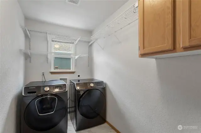 Spacious Laundry Room with Cabinet Space