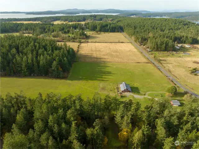 Aerial looking west over the nearly 30 acre property consisting of both pasture and forest.